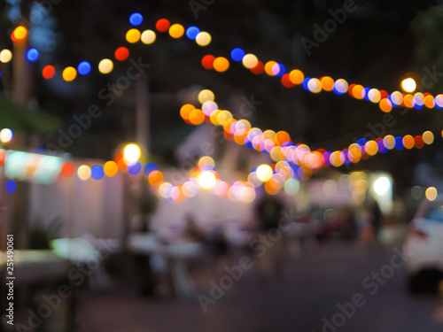 Vintage tone colorful of light abstract blur image of Night festival on street with light bokeh for background usage © Parichart