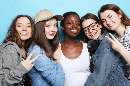 Foto Cheerful European, Asian and African womens.