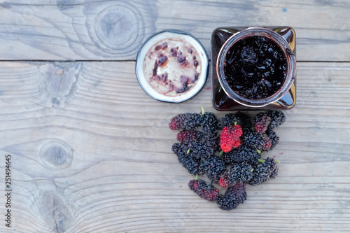 home made mulberry jam and fresh mulberry on wood background, Healthy eating and very useful.