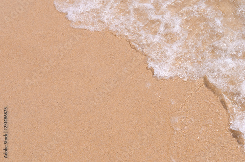 Copy space smooth wave beach with sand texture abstract background.