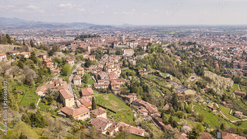 Bergamo, Italy. Drone aerial view of the old town. Landscape at the city center, its historical buildings and the Venetian walls a Unesco world heritage