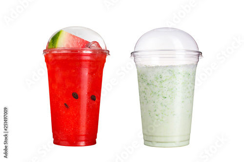 Delicious fruit smoothies in plastic cups, on a white background. Two cocktails with the taste of watermelon and milk.