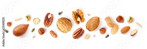 Creative layout made of hazelnut nuts, almonds, walnut, peanut, pecan, sunflower seeds on white background. Flat lay. Food concept.