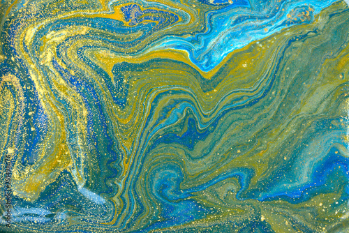 Blue and gold marbling pattern. Golden marble liquid texture.