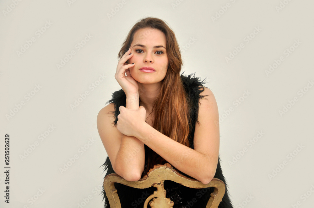 Portrait of beautiful positive young caucasian woman smiling and posing at camera on isolated white background Portrait of beautiful positive young caucasian woman smiling and posing at camera on isolated white background
