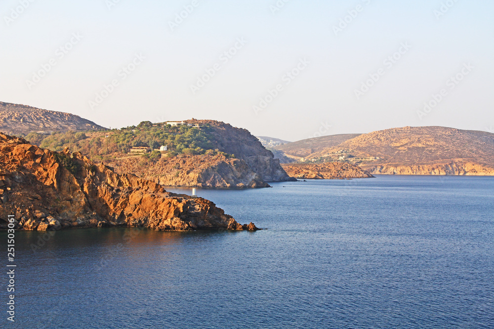 View of the island of Patmos, Greece in the Aegean Sea where St. Paul wrote the book of Revelation in the Bible with beautiful blue sky and water copy space.