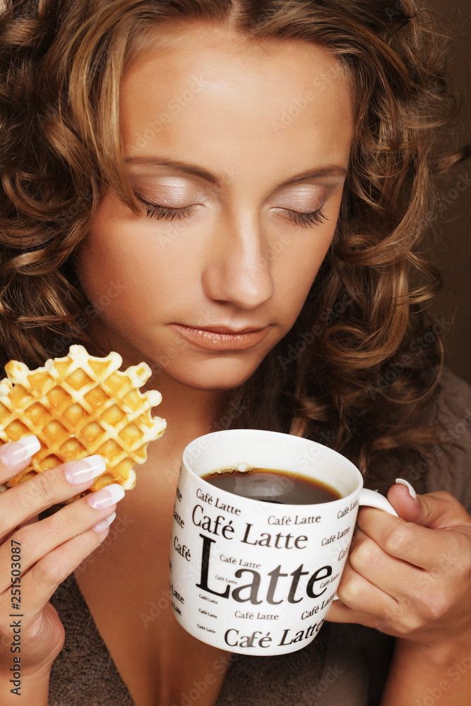 attractive woman with coffee and cookies attractive woman with coffee and cookies
