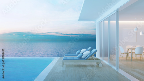Interior of a villa with a swimming pool. House overlooking the sea. Night. Evening lighting. 3D rendering.