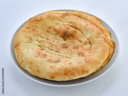a traditional pakistani fluffy and oily bread baked in clay oven