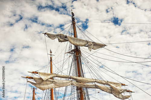 mast of old sailing ship on the sky background