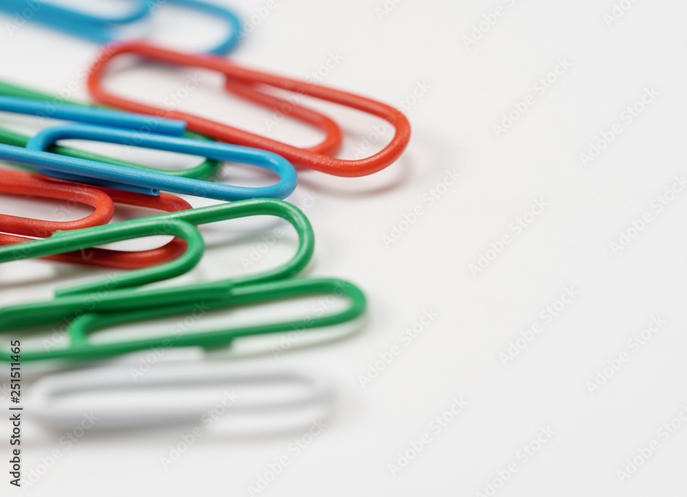 Colorful paper clips on white background soft-fokus Colorful paper clips on white background soft-fokus