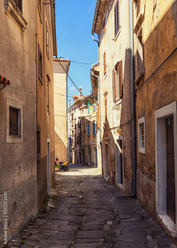 narrow cobblestone street in  Buje town, Croatia.