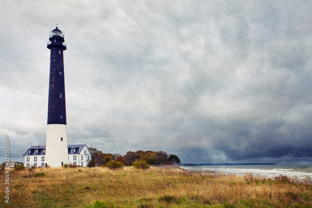 Sorve lighthouse in south Saaremaa, Estonia. Romantic lighthouse and cloudy sky in the coast of Baltic sea Sorve lighthouse in south Saaremaa, Estonia. Romantic lighthouse and cloudy sky in the coast of Baltic sea