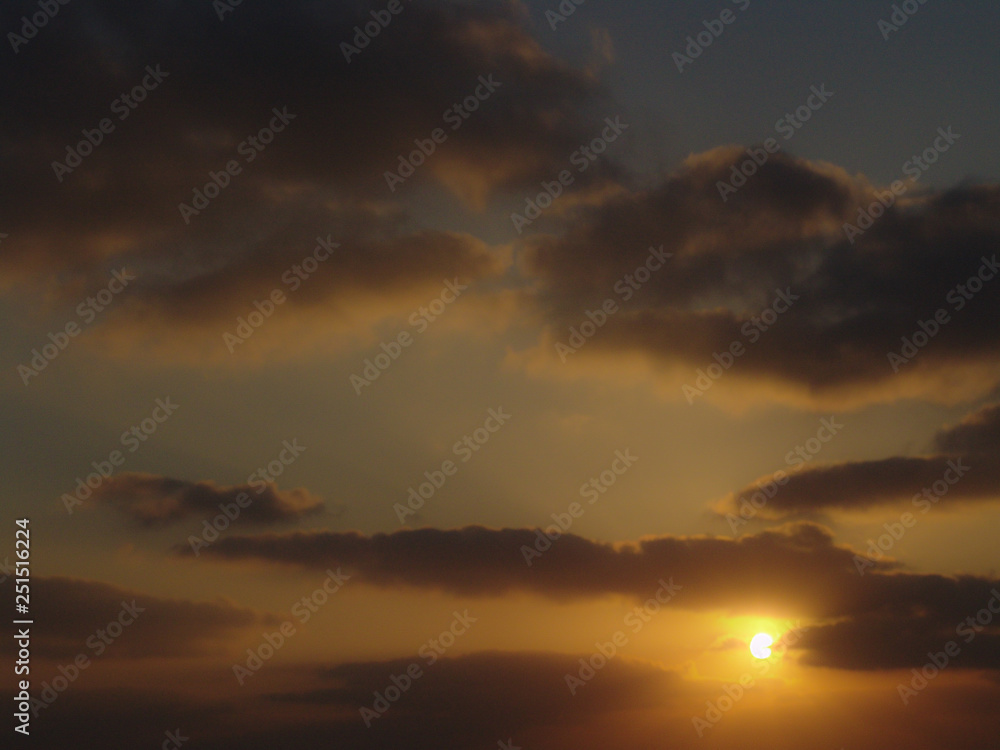 Golden light sunset view of a cloudy sky