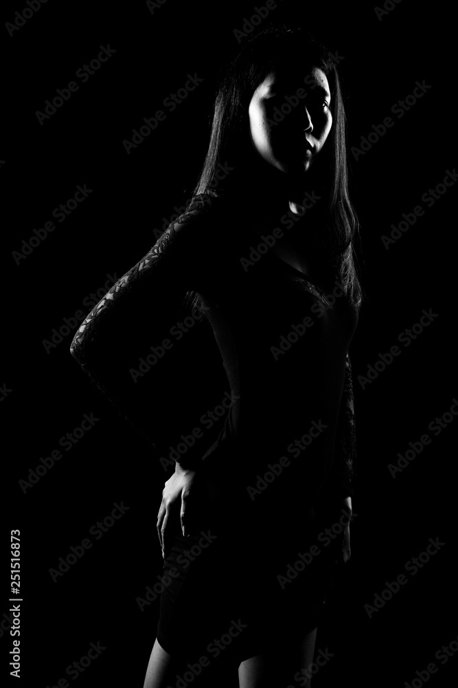 Silhouette Slim Skin Asian Woman black straight hair with Body Suit rim light, Abstract high low key exposure contrast, copy space for text logo, broken heart lonely girl can cry