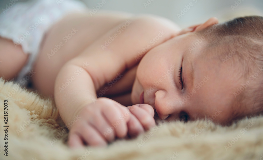 Fotografie Baby sleeping on a blanket