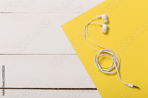 Wallpaper Mural Headphones on white wooden background Torontodigital.ca