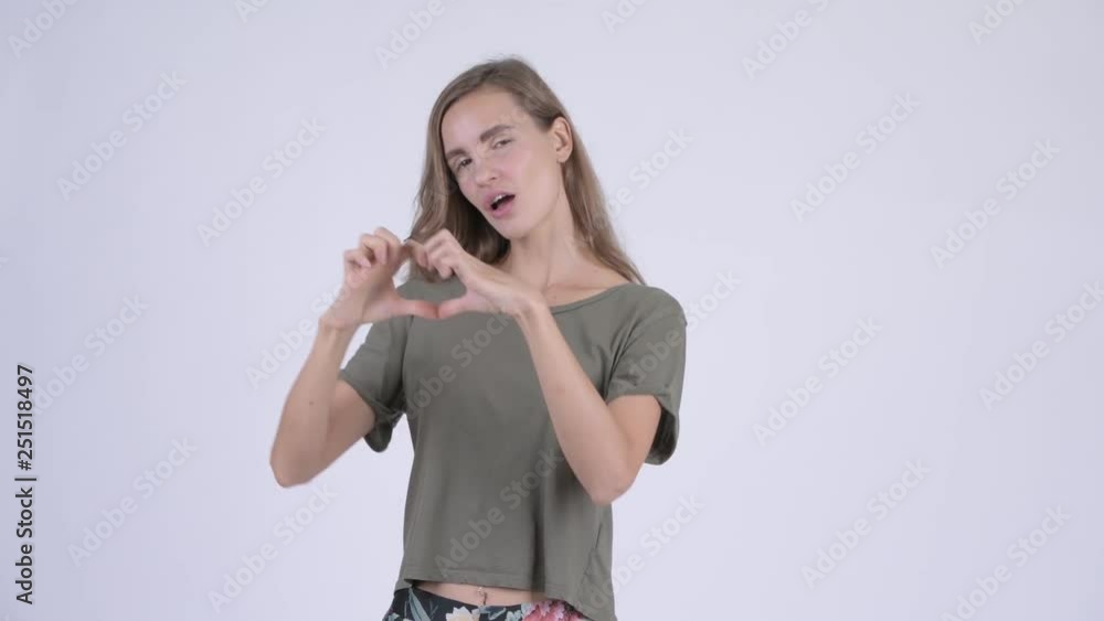 Happy young beautiful woman with hand heart gesture Happy young beautiful woman with hand heart gesture