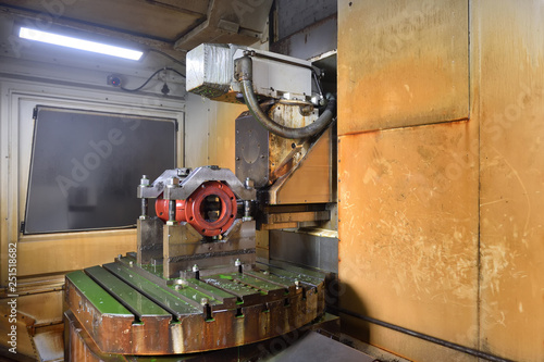 The body for creating the valve is installed on the table of the CNC machine for creating and grinding holes