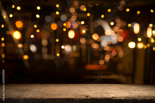 Beer barrel with beer glasses on a wooden table. The dark brown background. photo