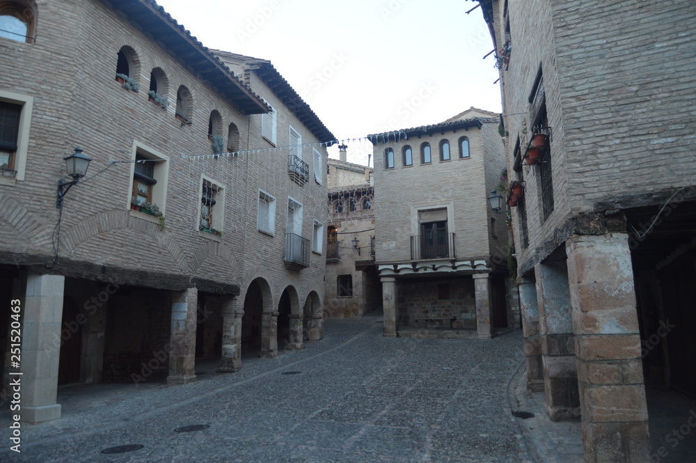 Fototapeta premium Rafael Ayerbe Square With Its Pretty Arched Soportals And Quables In Alquezar. Landscapes, Nature, History, Architecture. December 28, 2014. Alquezar, Huesca, Aragon, Spain