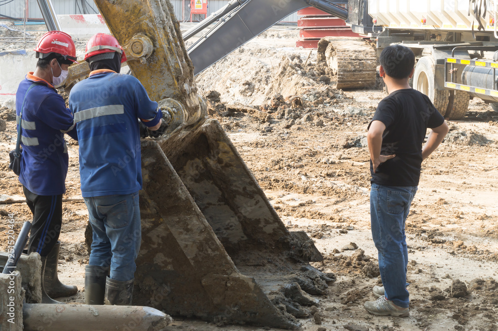 Workers working at construction site of underground station in Bangkok Workers working at construction site of underground station in Bangkok