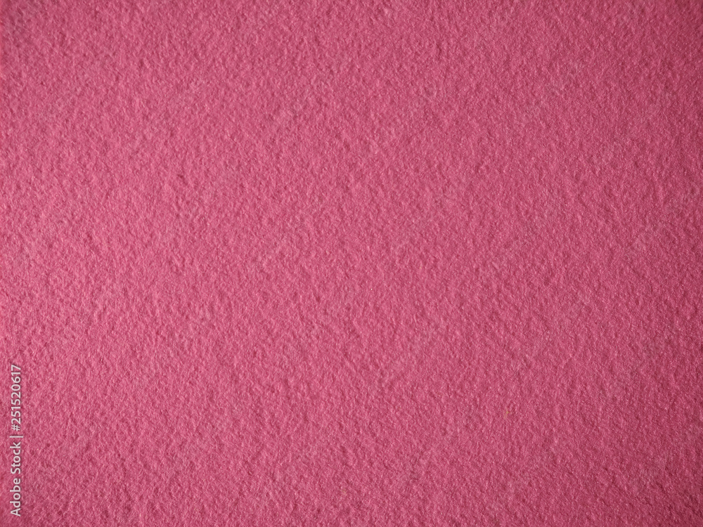 Fototapeta premium texture of homogeneous felt, solid pink fabric background