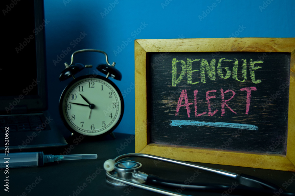 Dengue Alert Planning on Background of Working Table with Office Supplies. Medical and Healthcare Concept Planning on Blue Background Dengue Alert Planning on Background of Working Table with Office Supplies. Medical and Healthcare Concept Planning on Blue Background