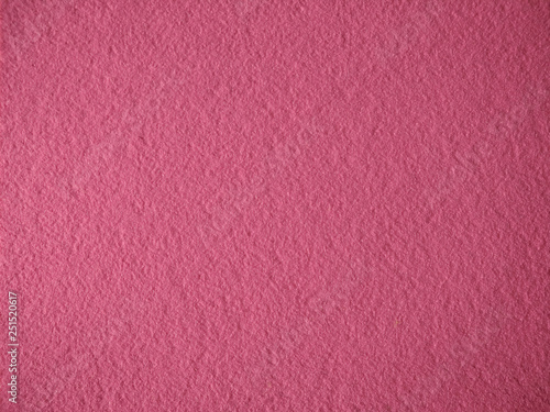 texture of homogeneous felt, solid pink fabric background
