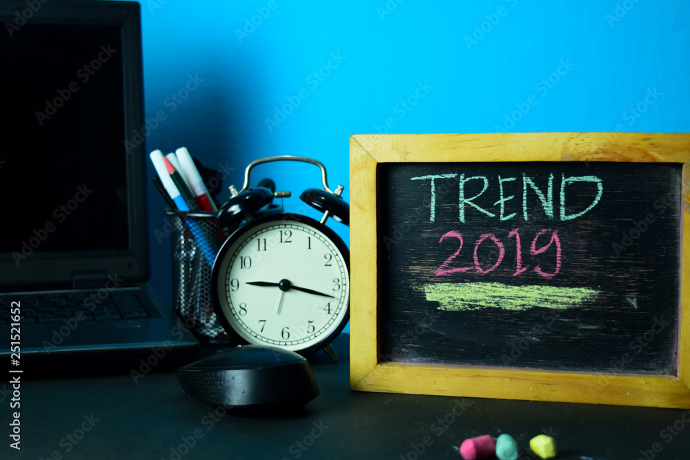 Trend 2019 Planning on Background of Working Table with Office Supplies. Business Concept Planning on Blue Background
