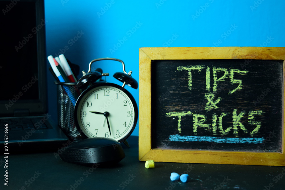 Tips & Tricks Planning on Background of Working Table with Office Supplies. Business Concept Planning on Blue Background Tips & Tricks Planning on Background of Working Table with Office Supplies. Business Concept Planning on Blue Background