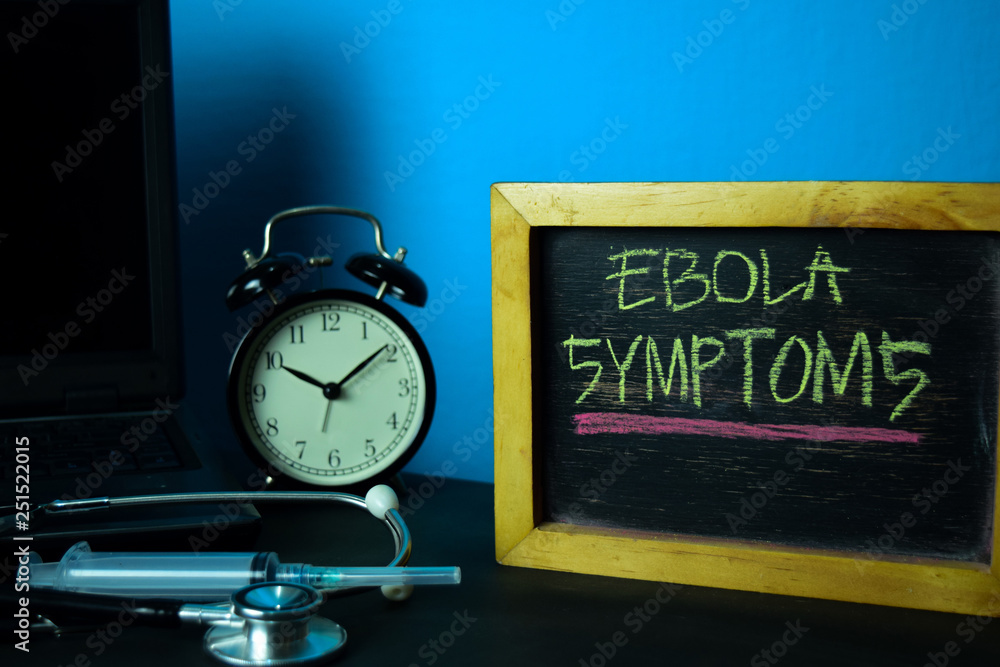 Ebola Symptoms Planning on Background of Working Table with Office Supplies. Medical and Healthcare Concept Planning on Blue Background Ebola Symptoms Planning on Background of Working Table with Office Supplies. Medical and Healthcare Concept Planning on Blue Background