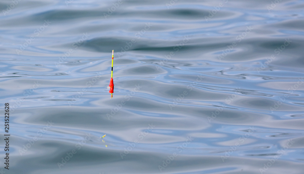 Float for fishing floats on the surface of the water Stock Photo