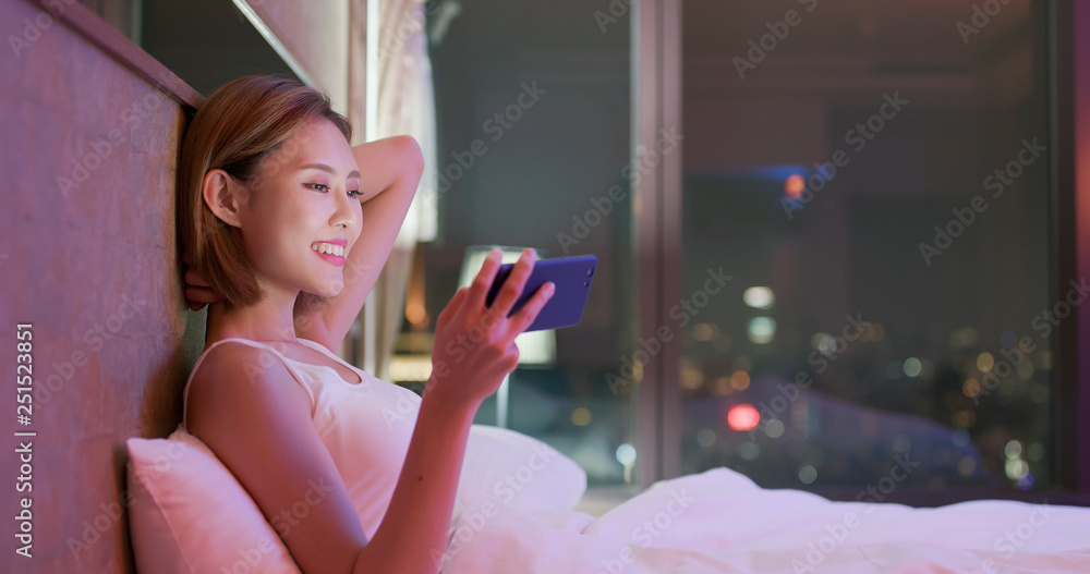 woman watch video by phone