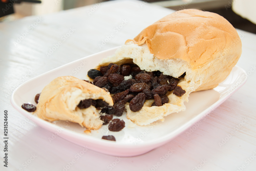 Raisins in bread put on the plate in the moring fastfood for energy in the day 