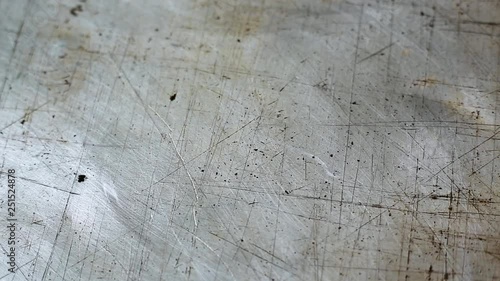 Olive vegetable oil is poured on an old metal baking tray close-up. cooking concept photo