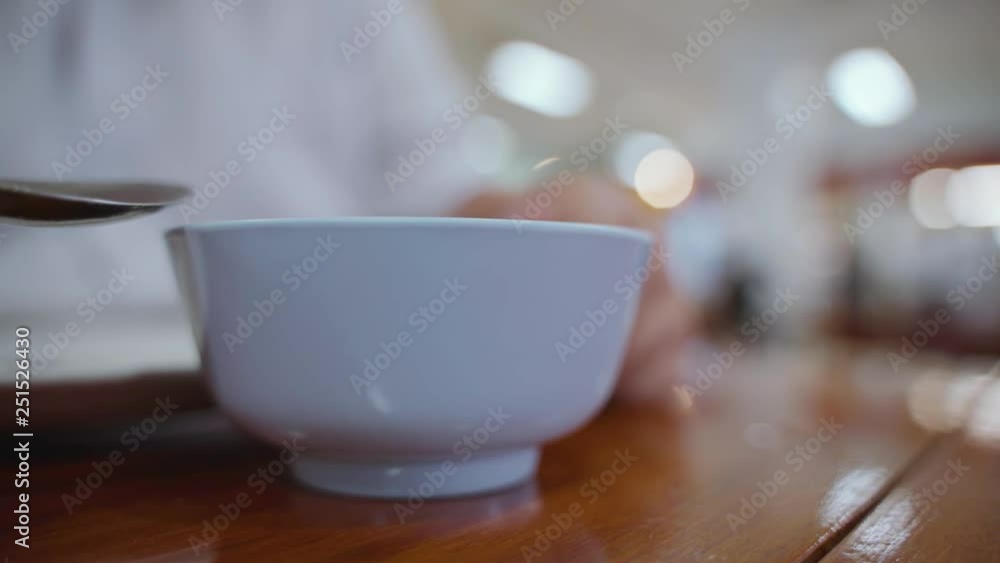 Round fat hand eating Asian rice and food with fork and spoon Round fat hand eating Asian rice and food with fork and spoon