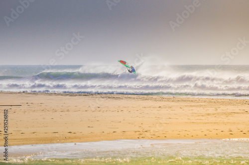 Windsurfer jumping a wave in Conil