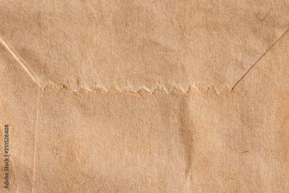 Brown paper bag texture ..Close up of kraft paper bag crease and