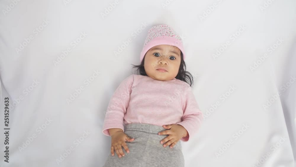 Happy African American Baby Girl Lying on Blanket at Home. Happy African American Baby Girl Lying on Blanket at Home.