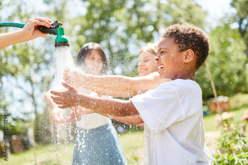 African boy gets splashed wet photo