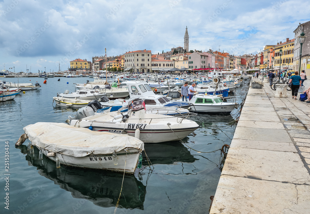 Pier in coastal town of Rovinj, Istria, Croatia. Rovinj - beautiful antique city, yachts and Adriatic Sea.