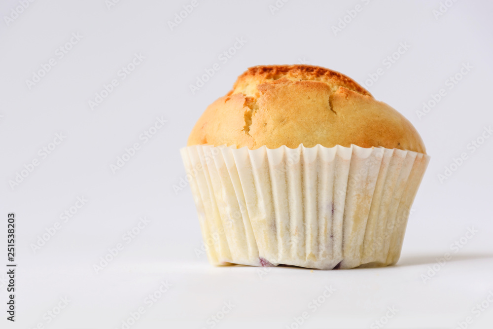 Fresh tasty muffins with berries on white background. Close up. Side view