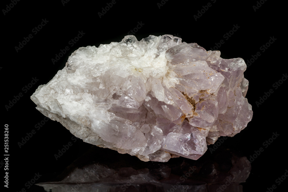 Macro mineral amethyst quartz stone on a black background Macro mineral amethyst quartz stone on a black background