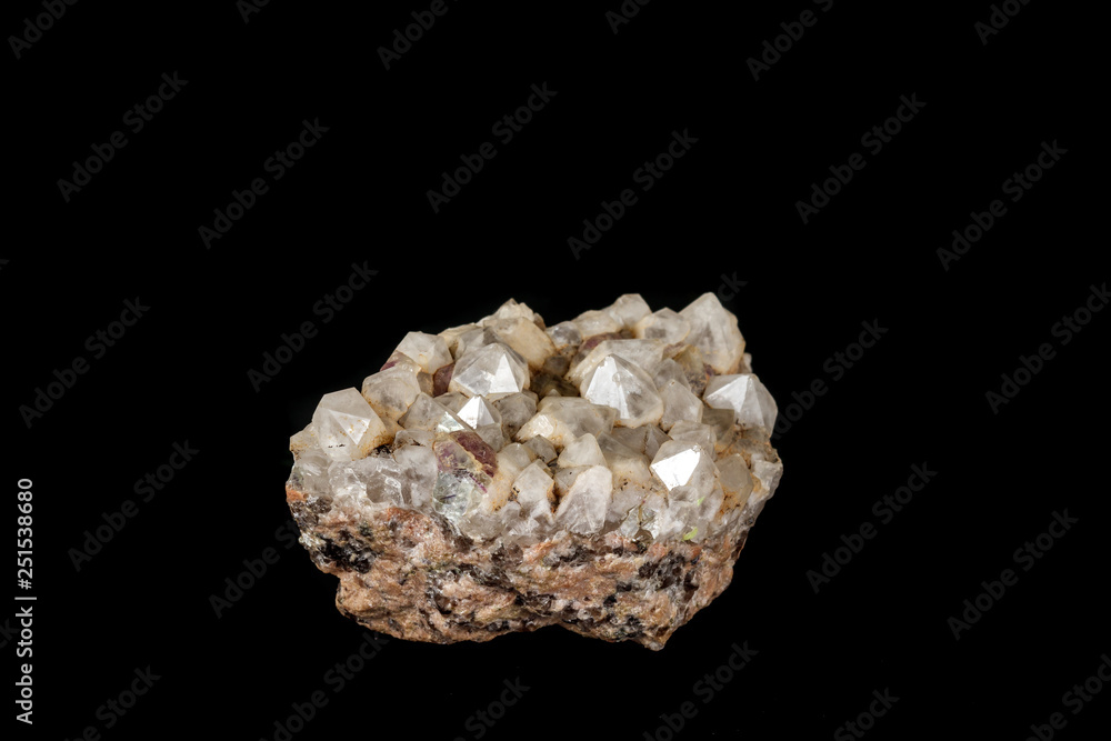 Macro mineral quartz stone with fluorite on granite on a black background Macro mineral quartz stone with fluorite on granite on a black background