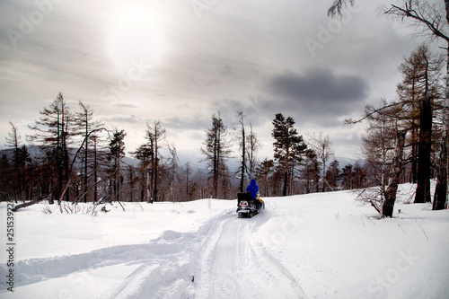 Athlete on a snowmobile.