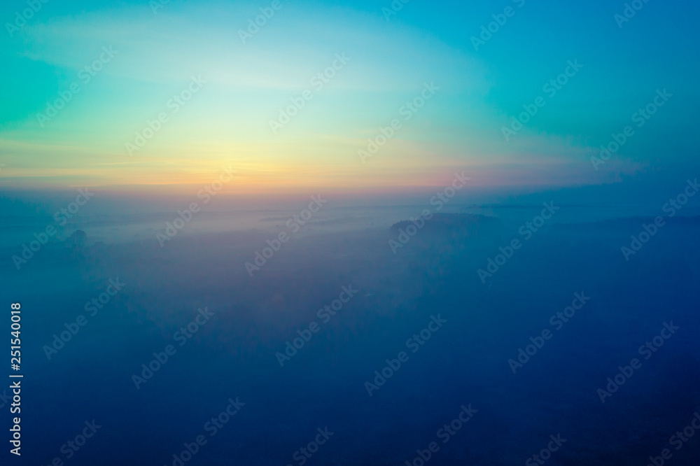 Early foggy morning. Aerial view of the countryside at sunrise