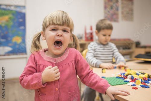 Fotografi Portrait of wept child girl in kindergarten