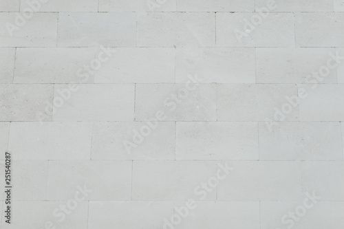 white texture of stone for background, place for writing © Elena