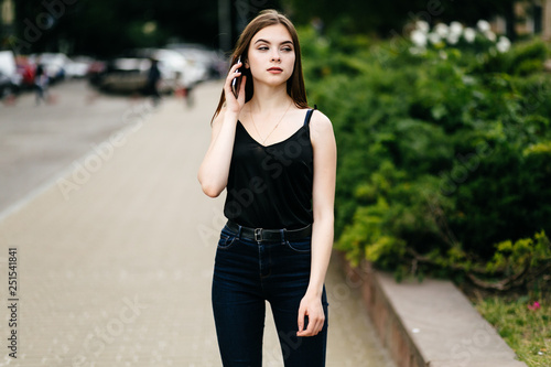 young girl posing on a street in the city